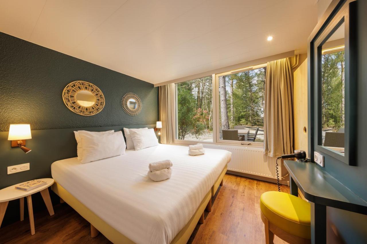 Center Parcs Les Hauts De Bruyeres Шомон-сюр-Тарон Экстерьер фото